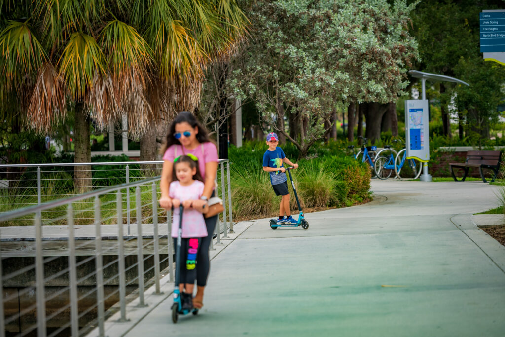 Family on scooters at Water Works Park