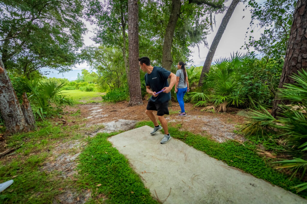 People playing disc golf at Barnett Park